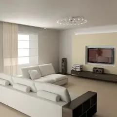 Nowoczesny salon z białymi sofami i designerskim oświetleniem sufitowym. Świetny pomysł na sufit w salonie, który dodaje elegancji.